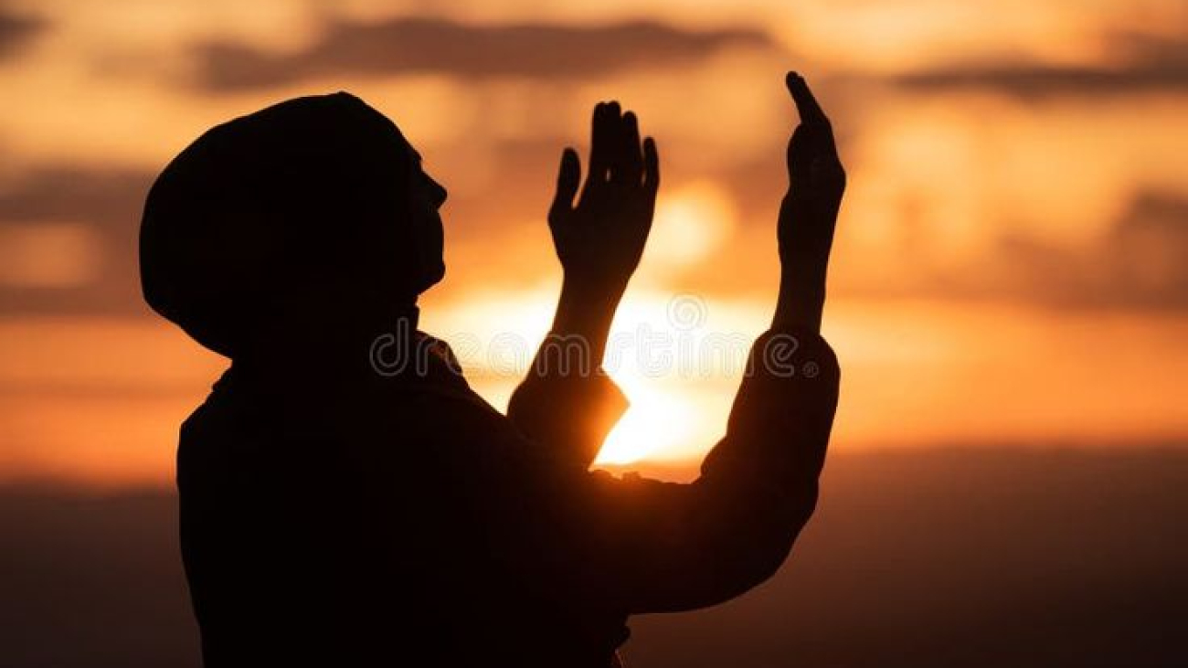 Muslim woman prayer praying with hands up open doing dua worship Allah_ royalty free sto